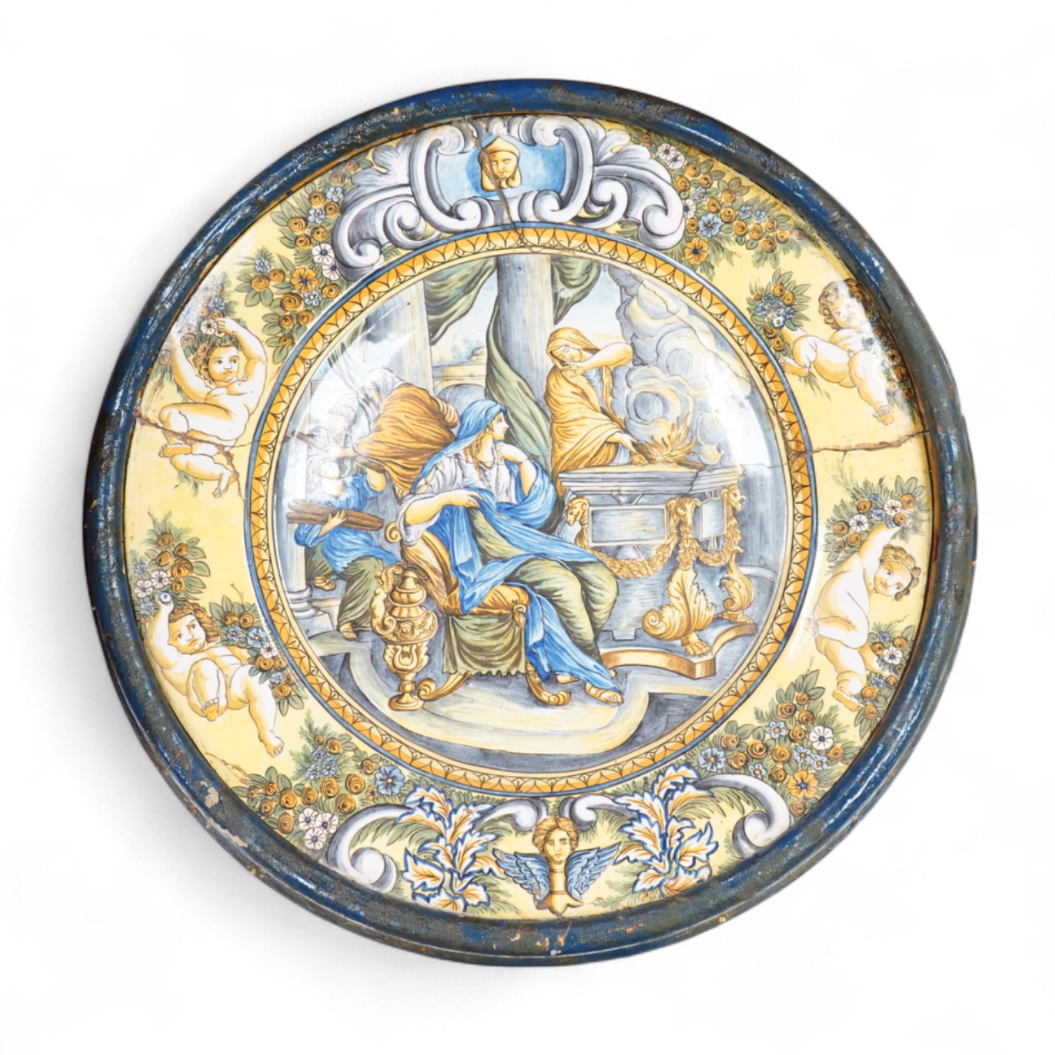 A 19th century Italian maiolica istoriata charger (riveted), framed, 56cm in diameter overall